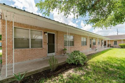 Back of house with a lawn and a patio area | Image 2