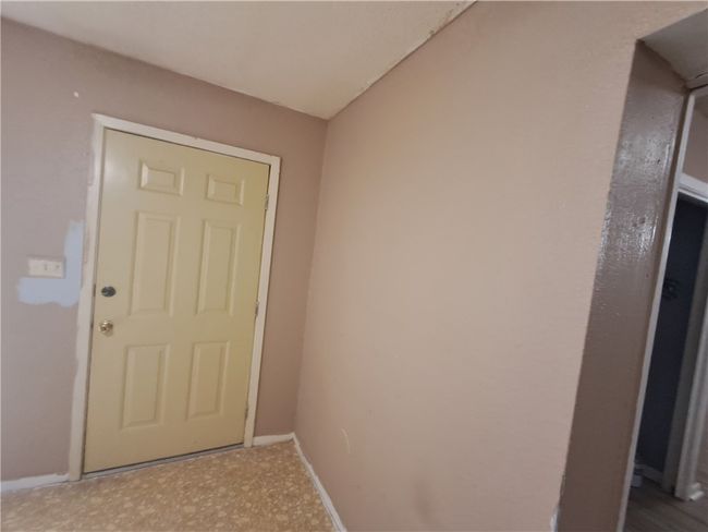 Doorway to outside with baseboards | Image 6