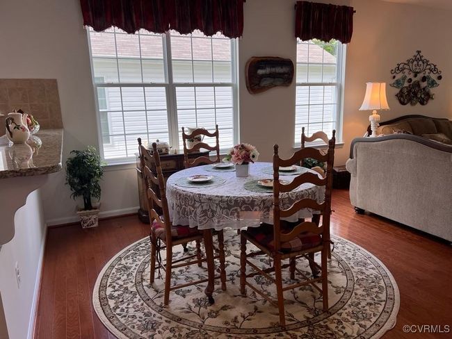 Dining room with dark hardwood / wood-style flooring | Image 22