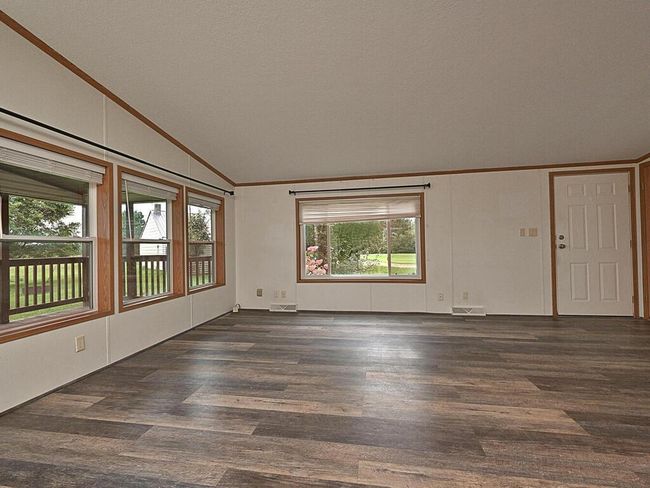 Large windows in the living room allow so much natural light. New flooring in the living room. | Image 8