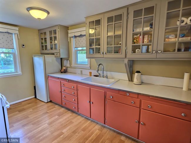 Plenty of storage in the many cabinets and counter space. Timeless and bright. | Image 7