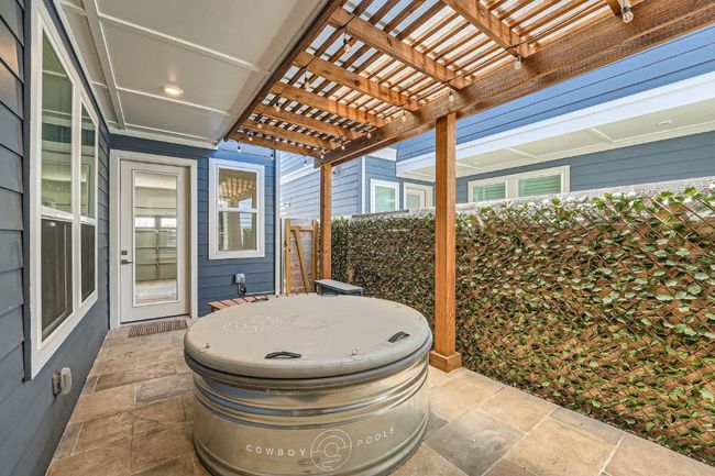 View of patio / terrace featuring fence and a pergola, and a professinally installed Cowboy sauna-pool! | Image 25