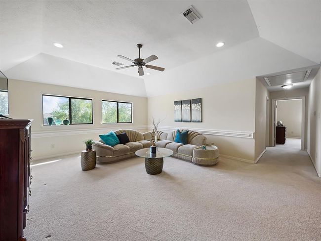 Expansive upstairs game room perfect for entertainment and relaxation. | Image 35