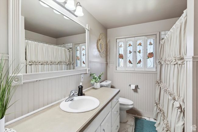 Full bath with vanity and a wainscoted wall | Image 15