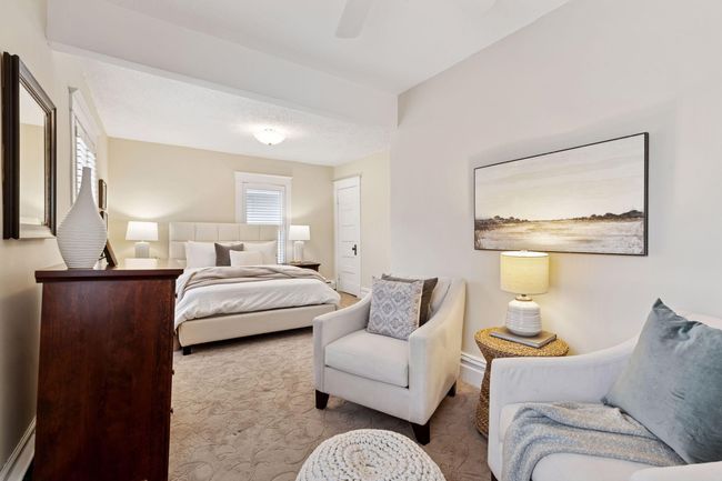 The owner's bedroom is bright, with space for a sitting area or a home office. | Image 22