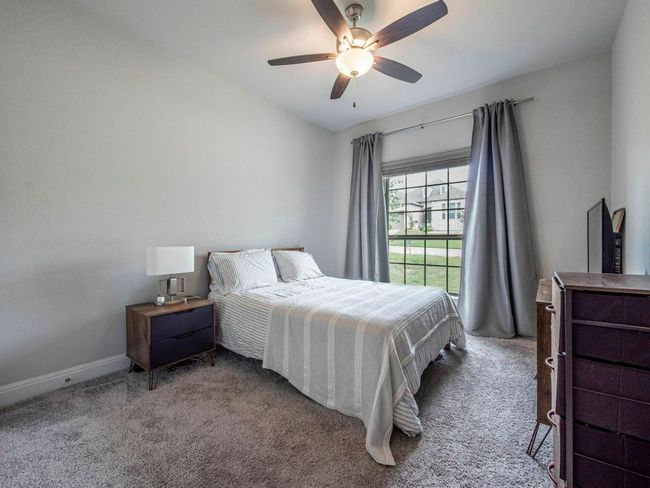 Bedroom featuring carpet flooring and a ceiling fan | Image 18
