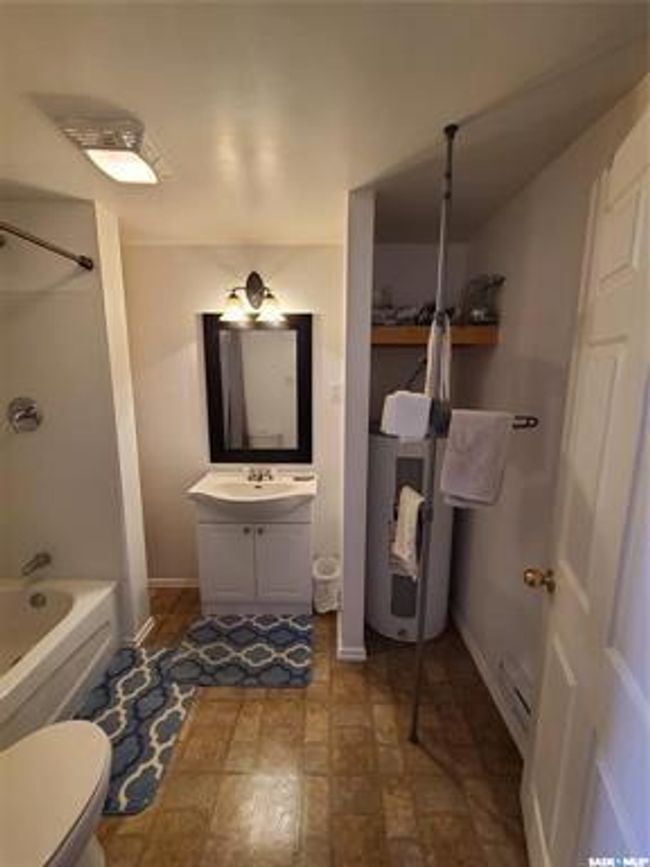 Bathroom featuring tile patterned floors, vanity, and toilet | Image 33