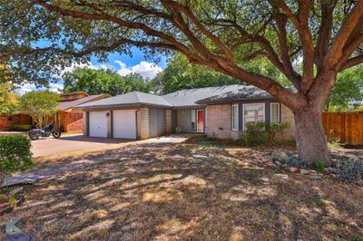 Single story home with a garage | Image 1