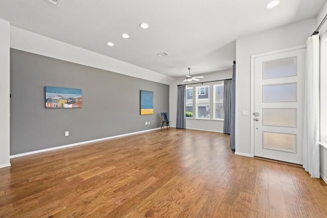 Unfurnished living room with recessed lighting, light wood-style flooring, and ceiling fan | Image 6