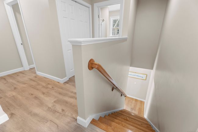 Upper level hallway. Washer and Dryer hook-up behing doors | Image 15