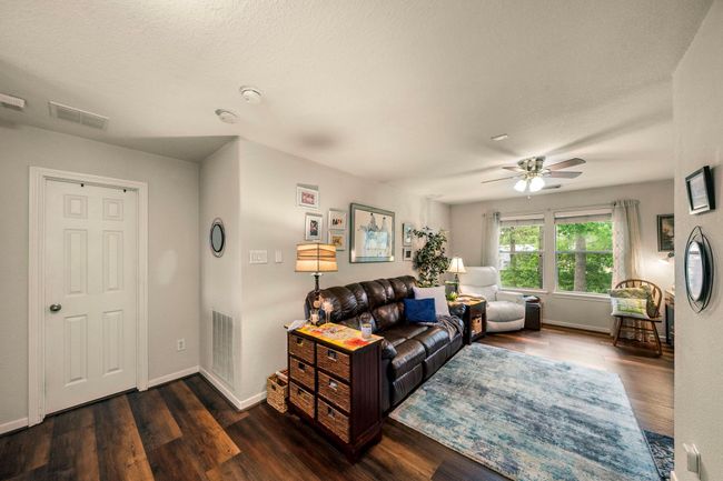 Upstairs family room offers a place to unwind and enjoy a movie night with the family. | Image 4