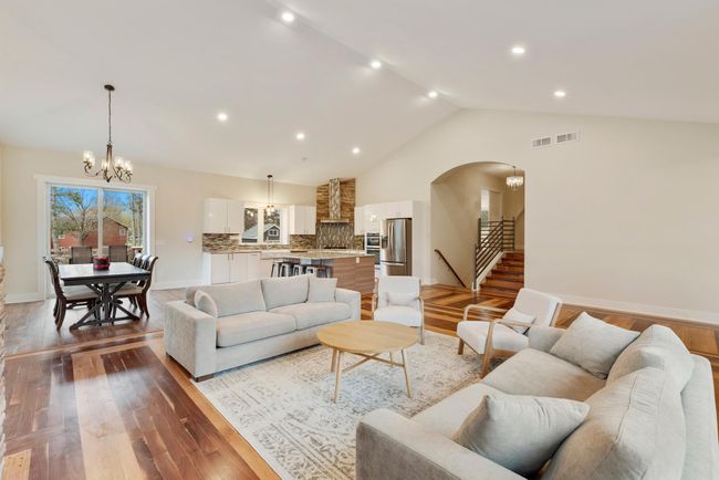 Vaulted ceilings and recessed lighting open the main level space creating a bright & inviting space. | Image 8