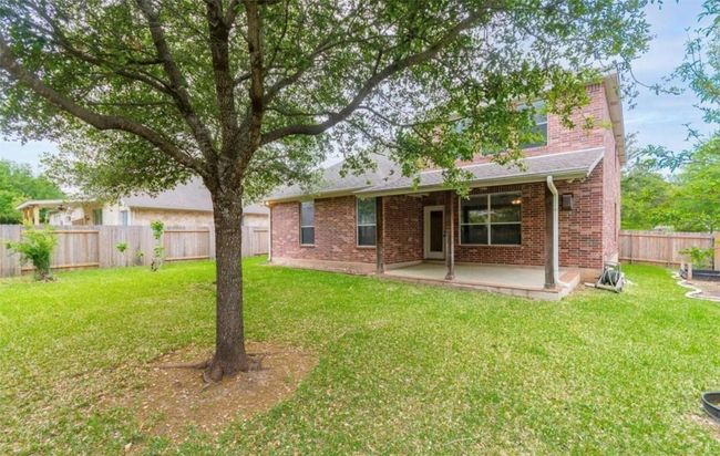 Rear view of house with brick siding and a patio | Image 30