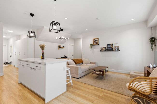 Living area with baseboards, light wood finished floors, and recessed lighting | Image 10