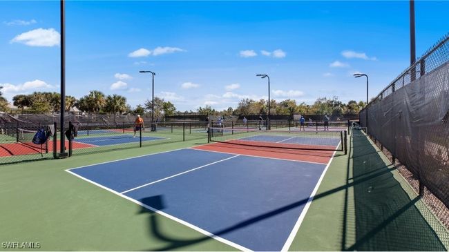 View of tennis court with community basketball court and fence | Image 43