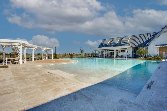 Community pool with a pergola and a patio area | Image 39