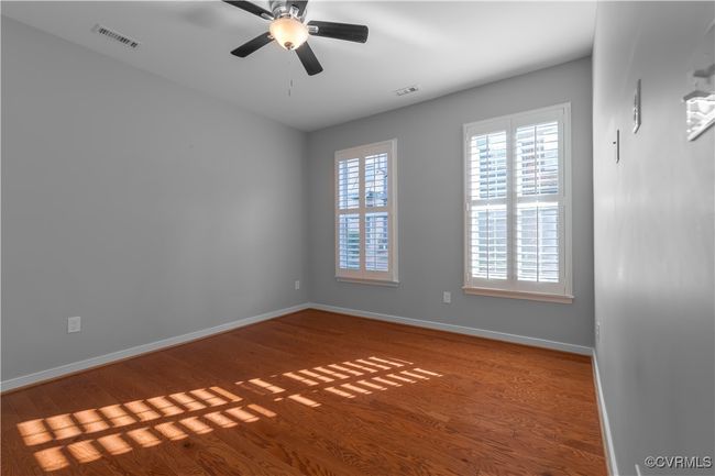 Empty room featuring dark hardwood / wood-style flooring and ceiling fan | Image 18