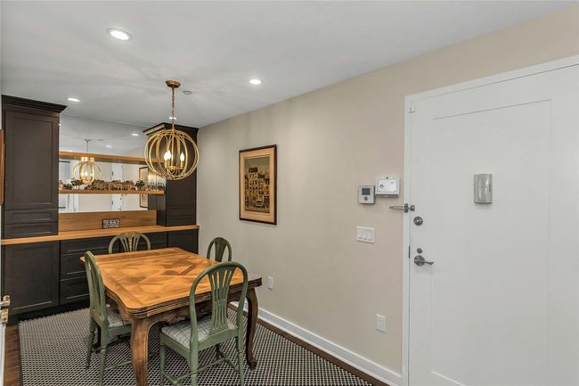 Dining room with a chandelier, recessed lighting, and baseboards | Image 5