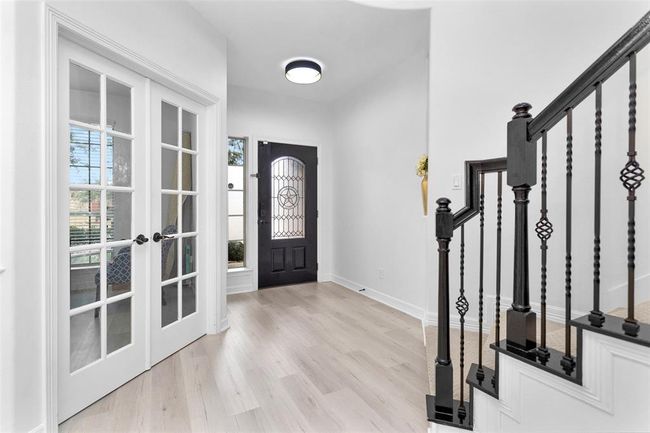 French doors, just off the foyer, welcome you to the home office/study. | Image 6