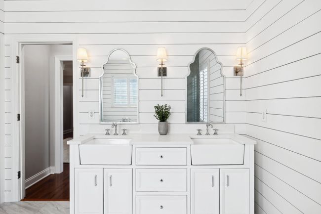 Custom mirrors, farmhouse sinks, and built-in lighting add charm and function. | Image 19