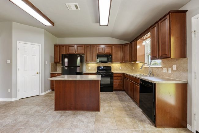 Kitchen with large pantry | Image 11