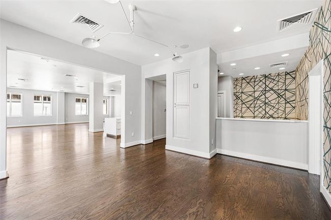 Bar area opens directly into incredible open concept living space. | Image 7