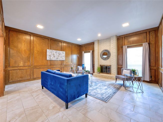 Living room with a floor to ceiling brick fireplace and recessed lighting | Image 5