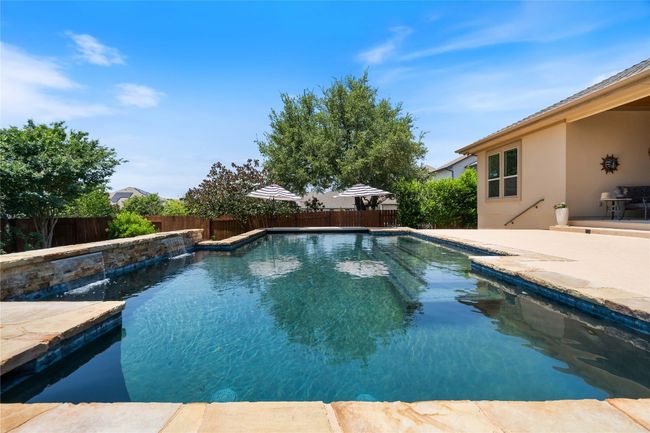 Backyard Oasis with Sparkling Pool, Pergola, and Outdoor Kitchen | Image 35