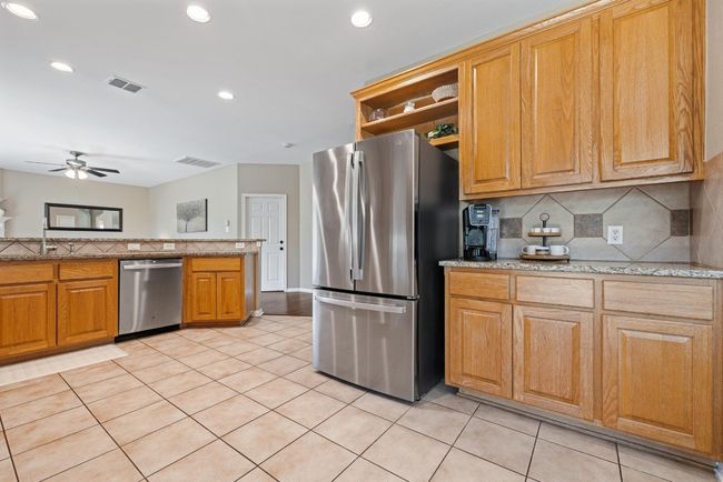A soft stream of natural light spills in through the kitchen, offering a peaceful ambiance that makes even the simplest tasks feel more enjoyable | Image 15