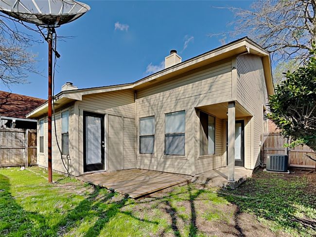 Back of property featuring a chimney and a patio | Image 15