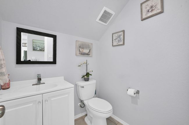 The powder bathroom is just off the foyer. | Image 29