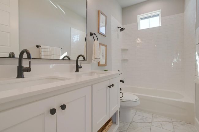 Full bathroom with vanity, toilet, and bathing tub / shower combination | Image 23
