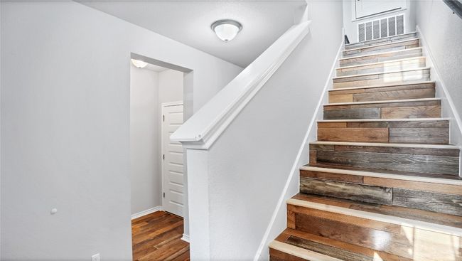 Stairs with wood finished floors | Image 16
