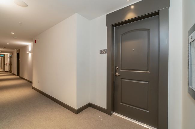 Hallway featuring light carpet, baseboards, and recessed lighting | Image 30