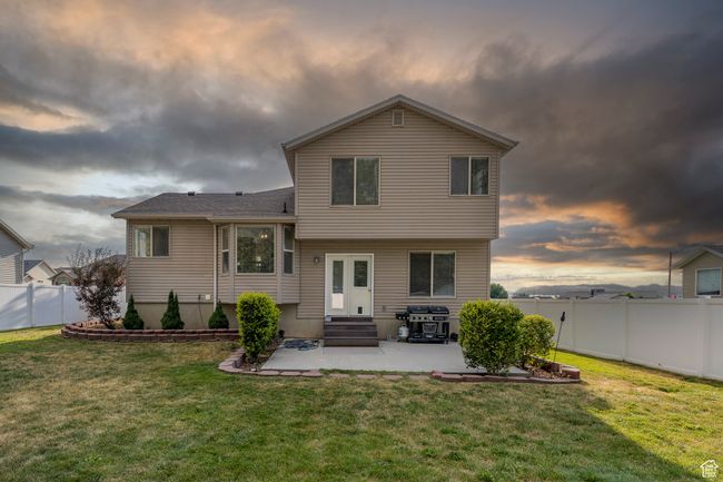 Back of property featuring a patio area, a fenced backyard, and entry steps | Image 28