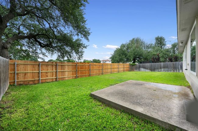 Fenced backyard featuring a patio area | Image 34