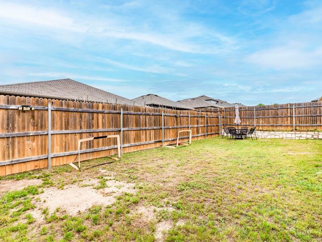 View of yard with a fenced backyard | Image 29