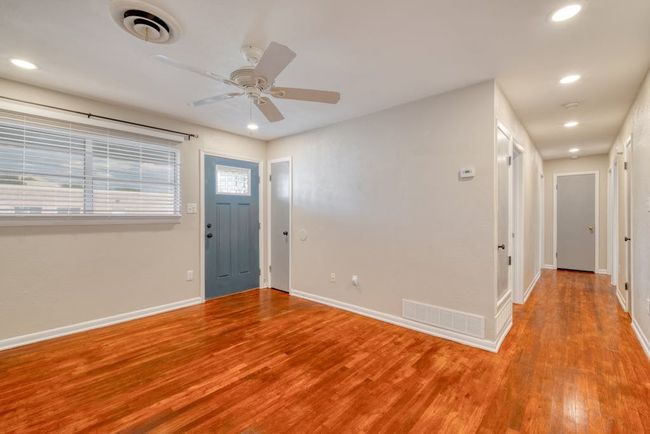 Entryway featuring light wood-style floors, baseboards, visible vents, and recessed lighting | Image 7