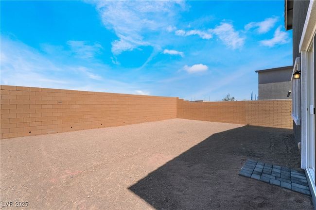 View of fenced backyard | Image 36