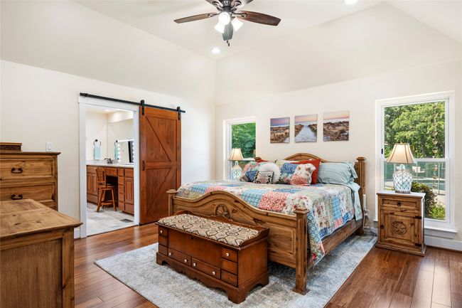Look at all this beautiful natural in the primary bedroom and these bamboo floors | Image 23