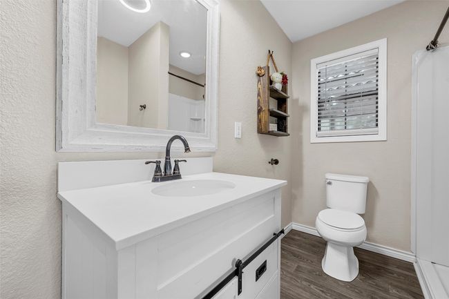 Full bathroom with vanity and wood finished floors | Image 17