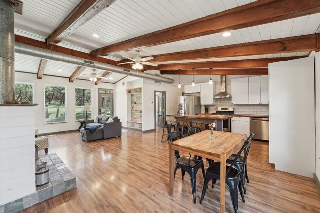 Dining space with a ceiling fan, beamed ceiling, light wood-style floors, recessed lighting, and baseboards | Image 8