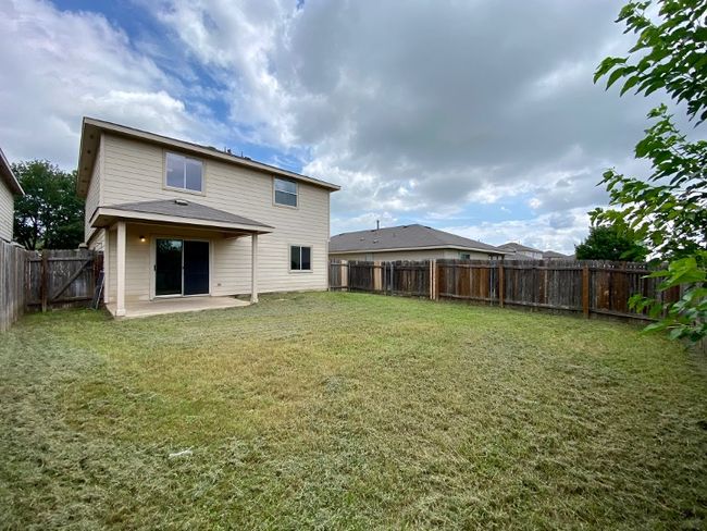 Rear view of property featuring a patio and a fenced backyard | Image 29