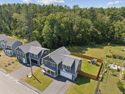 Aerial 12 Intrepid shows fenced backyard | Image 3