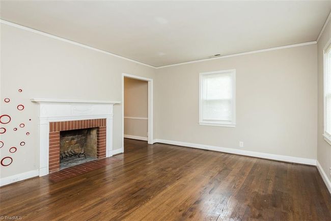 Wood burning fireplace in living room | Image 7