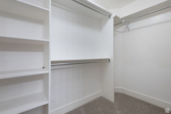 Walk in closet with carpet flooring | Image 17