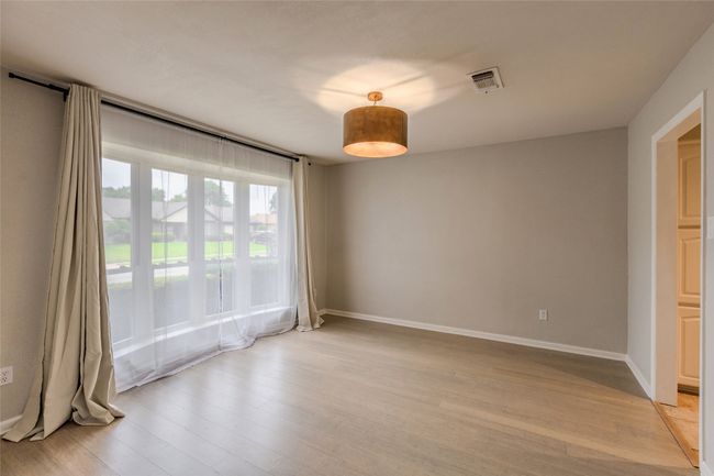 Empty room featuring light wood-type flooring and baseboards | Image 26