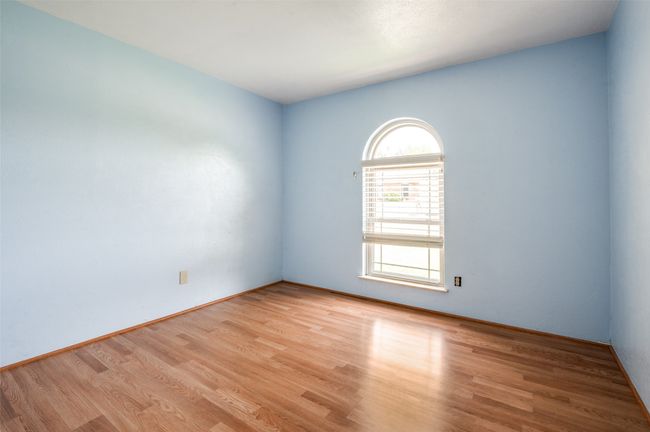 Empty room featuring plenty of natural light and light wood-type flooring | Image 16