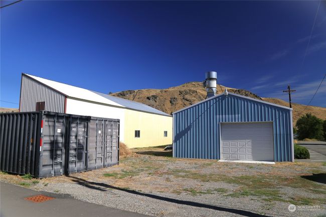 a small office, restroom, and two storage containers. | Image 6