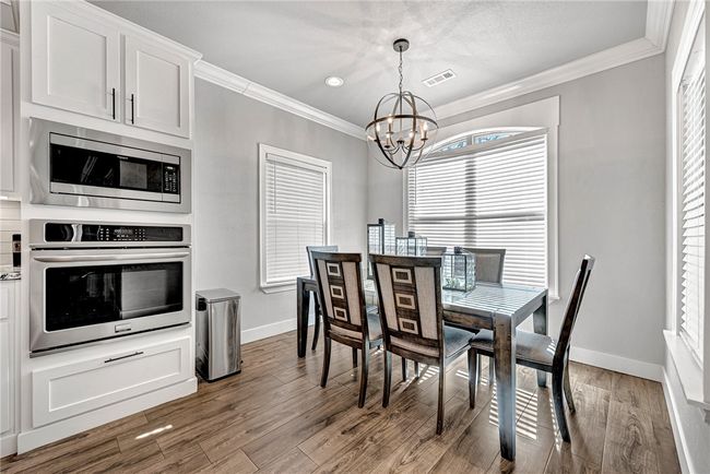 Convenient breakfast nook. Notice the convection oven and built in microwave. | Image 10